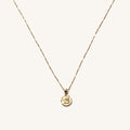 The 14k Cherub necklace, a solid gold cherub pendant on a dainty chain