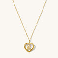 Corazon initial necklace with a solid gold letter outlined by a heart