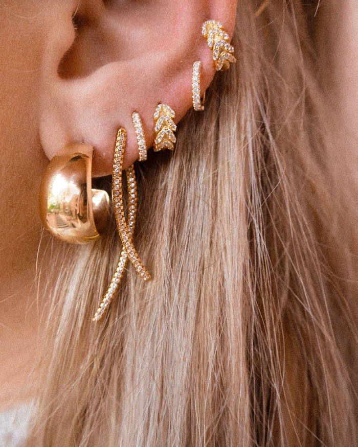 Stella diamond huggie earring in solid 14k gold, sold as a single
