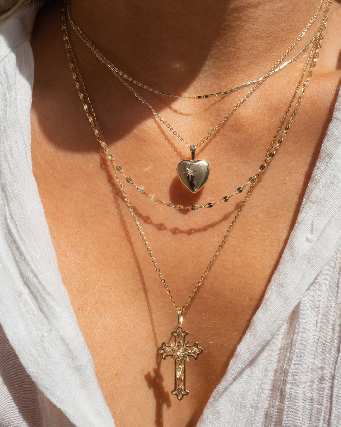 Model wearing the Disco Tile necklace catching light along the collarbone