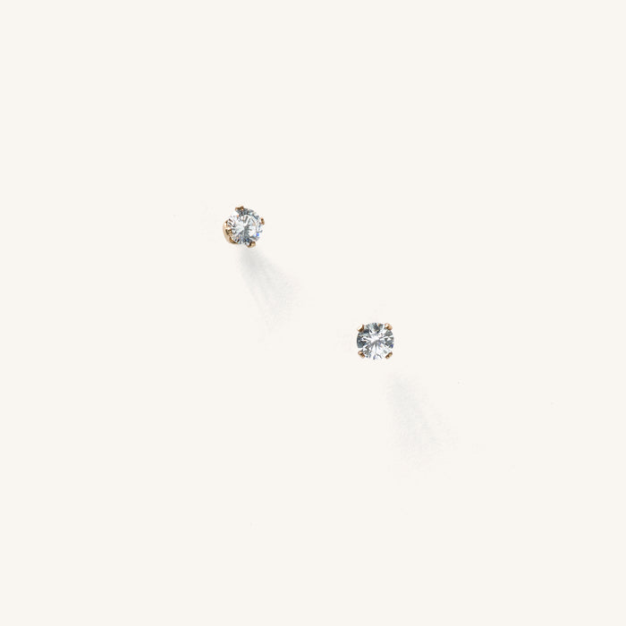 Close up of white stone studs on a white background