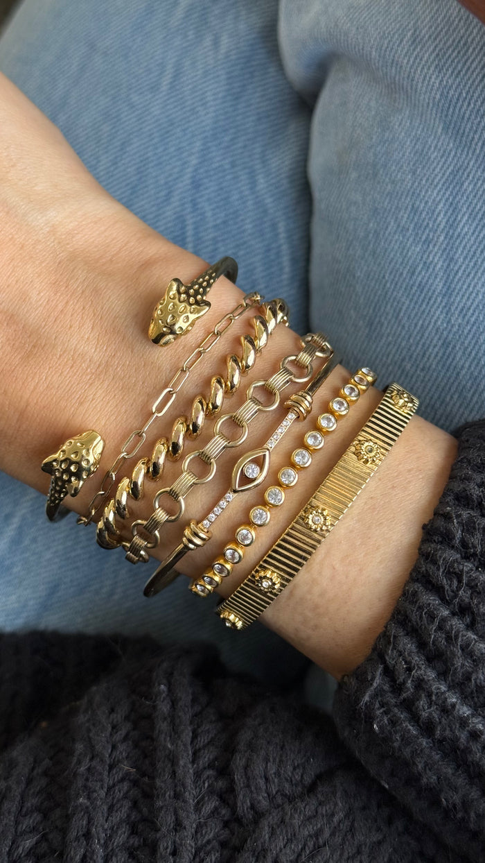 Gold Yaz bangle set with white topaz, flexible enough to slip on and off