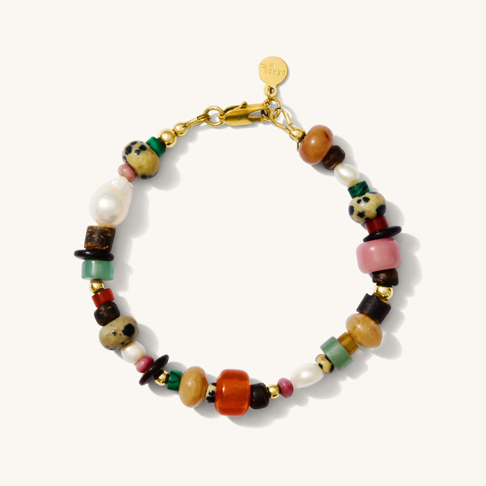 Close up of the Andie bracelet with mixed gemstones and pearls on a white background