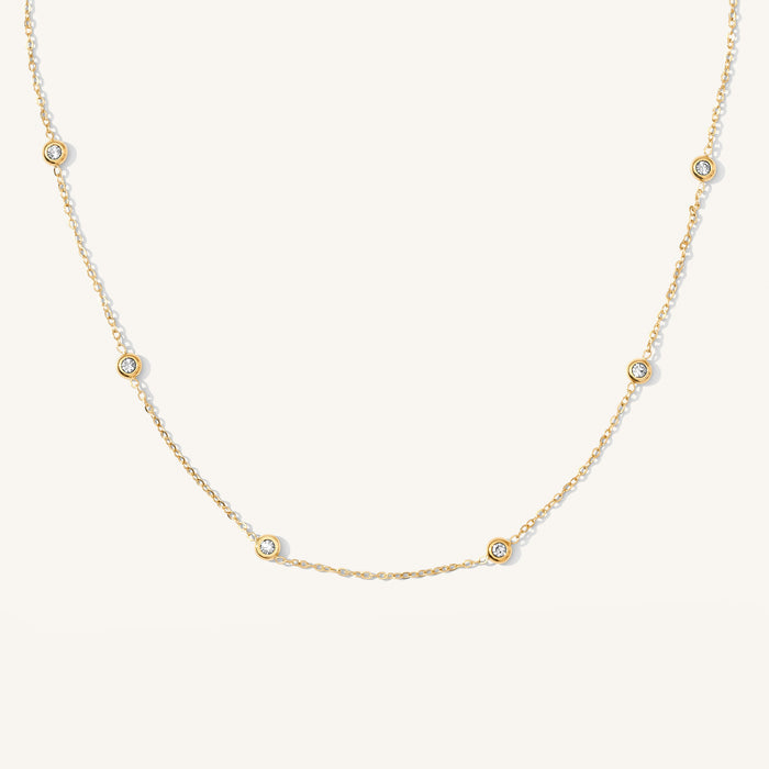 The Anna bezel necklace with bezel-set crystal stations in gold fill