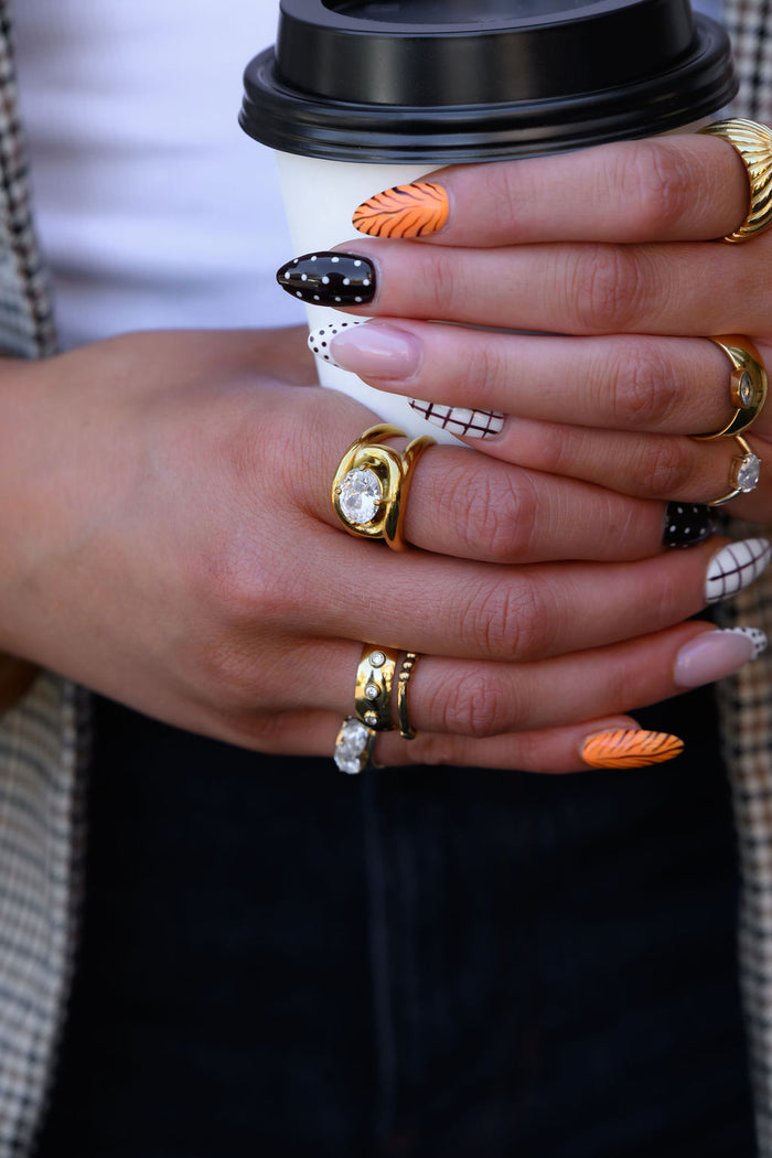 The Anna ring in gold, adjustable from a size 6 to 9 for a dainty stack
