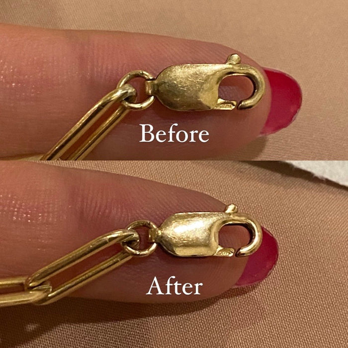 Close up of the anti-tarnish polishing cloth being used on gold jewelry