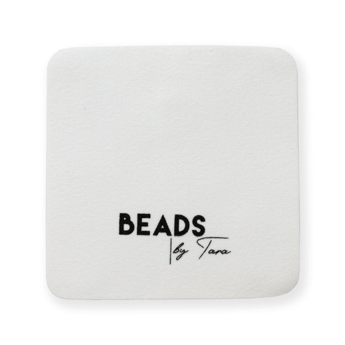 The jewelry polishing cloth from Beads by Tara shown in use up close