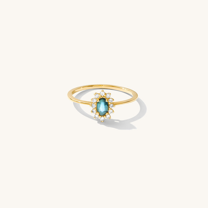Azul ring with a soft blue sapphire center stone framed by sparkling crystals