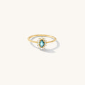 Azul ring with a soft blue sapphire center stone framed by sparkling crystals