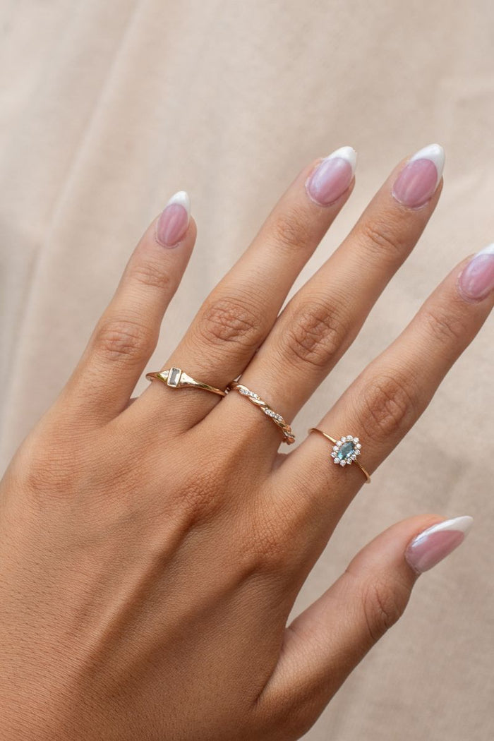 The Azul ring, a delicate stacking band set with a soft blue sapphire