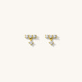 Close up of the gold Baguette Drop earrings on a white background