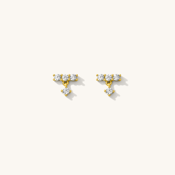 Close up of the gold Baguette Drop earrings on a white background
