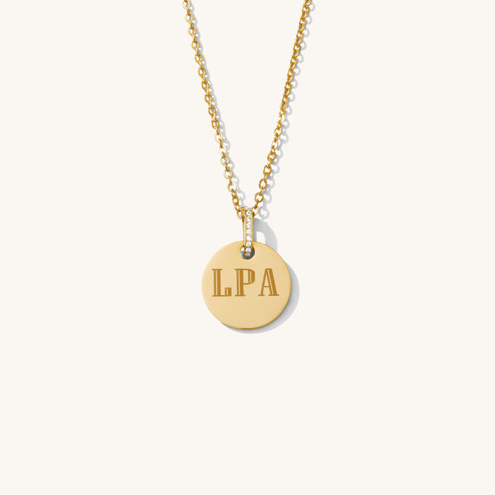 The Bailey circle necklace with a crystal-accented bail in gold