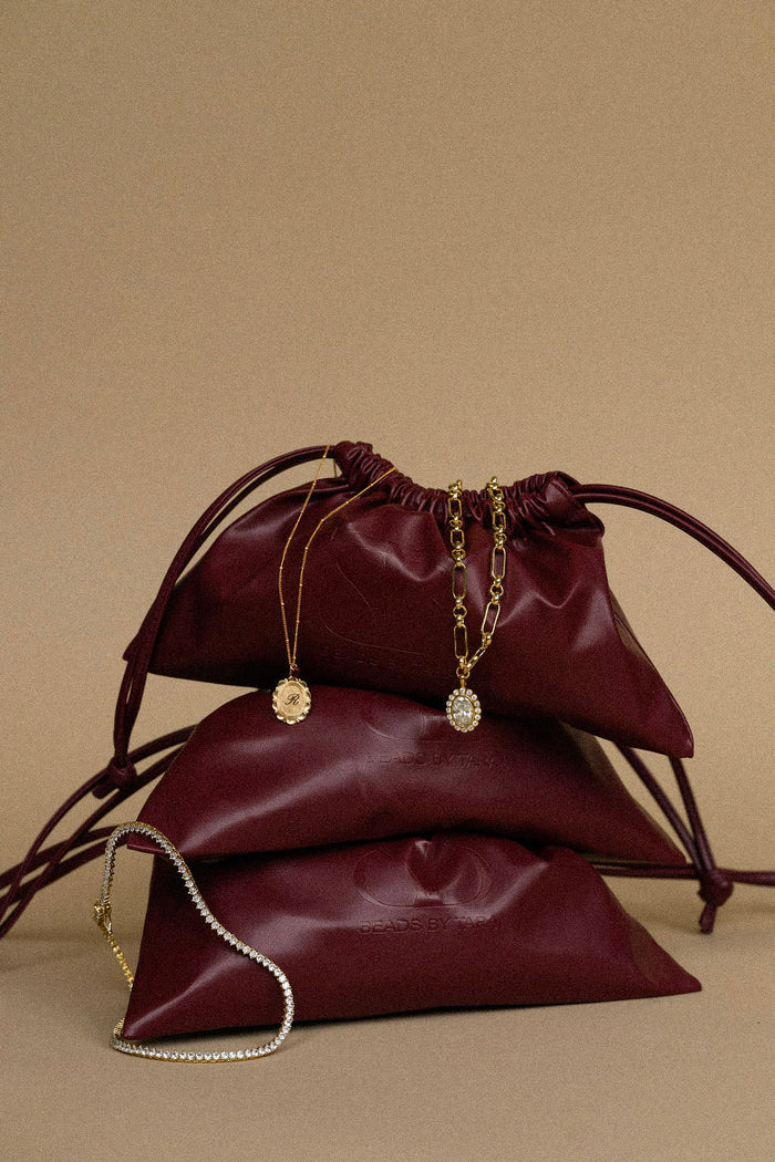 Bardot drawstring pouch in vegan leather with a soft vegan suede interior