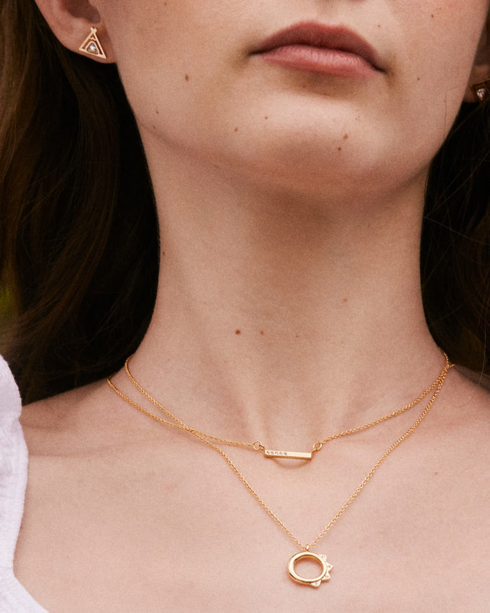 Model wearing Blank Slate Necklace, Squad Necklace, and Tribe Earrings in Gold