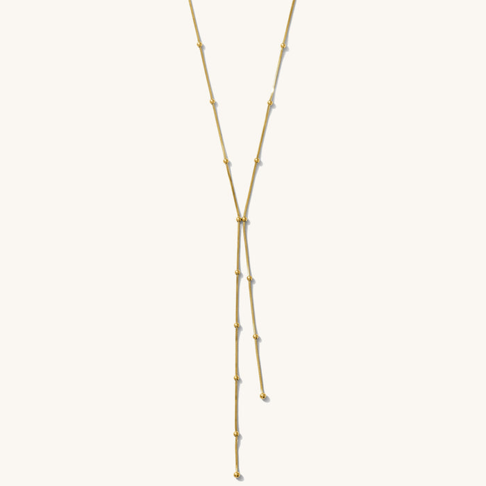 Gold necklace on a white background