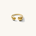 Cabana ring, an 18k gold statement cuff ring that frames the finger