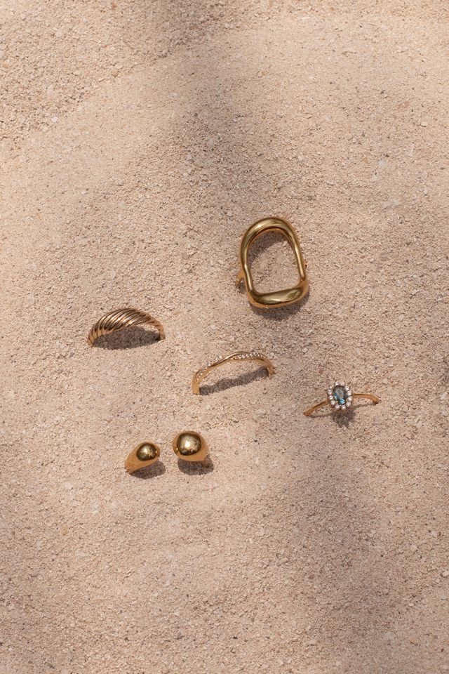 The Cabana ring showing its polished gold finish and open-back cuff