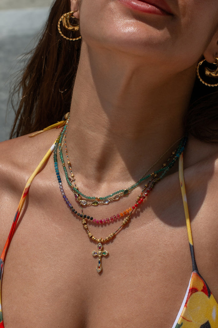 The Caliente necklace pendant showing its mix of colored stones and crystals