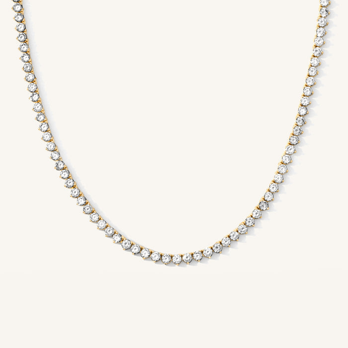 The Carissa tennis necklace with three-prong set crystal stones in gold