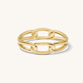 Close up of gold cuff bracelet on a white background
