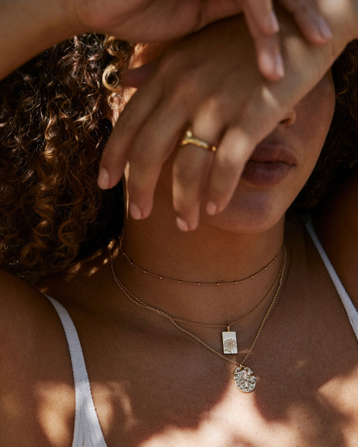 Bryan Anthonys Chasing Light Gold Necklace on Model