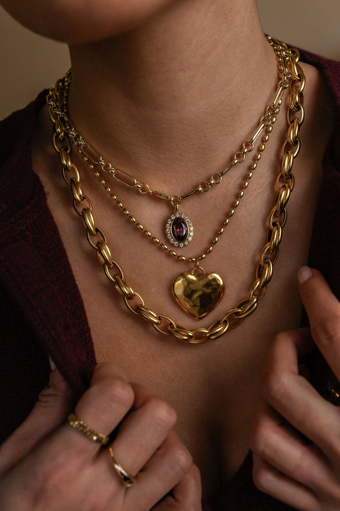 Gold Cherie necklace with a softly sculpted, molten-finish heart pendant