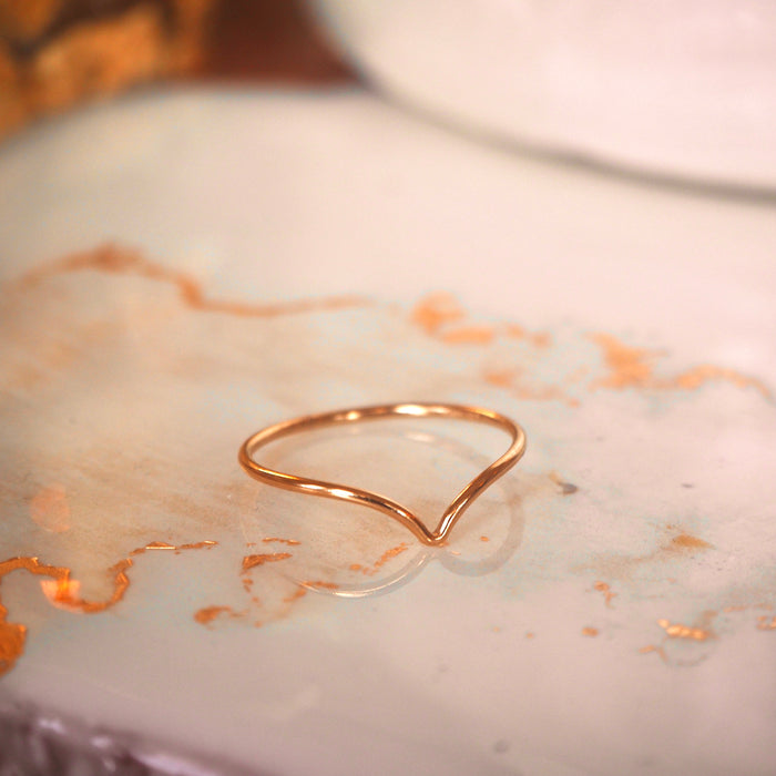 The Chevy ring worn stacked with other thin gold-filled bands