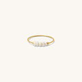 Close up of the gold Cinque Terre pearl ring on a white background