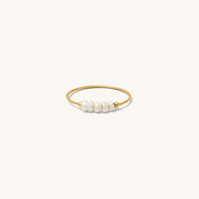 Close up of the gold Cinque Terre pearl ring on a white background