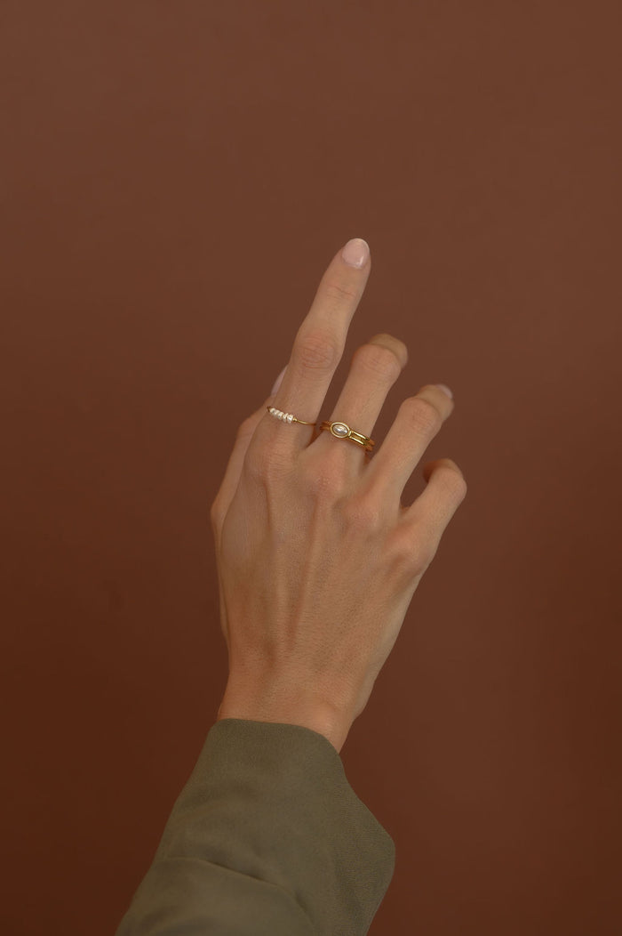 Studio close up of the gold Cinque Terre pearl ring on a white background