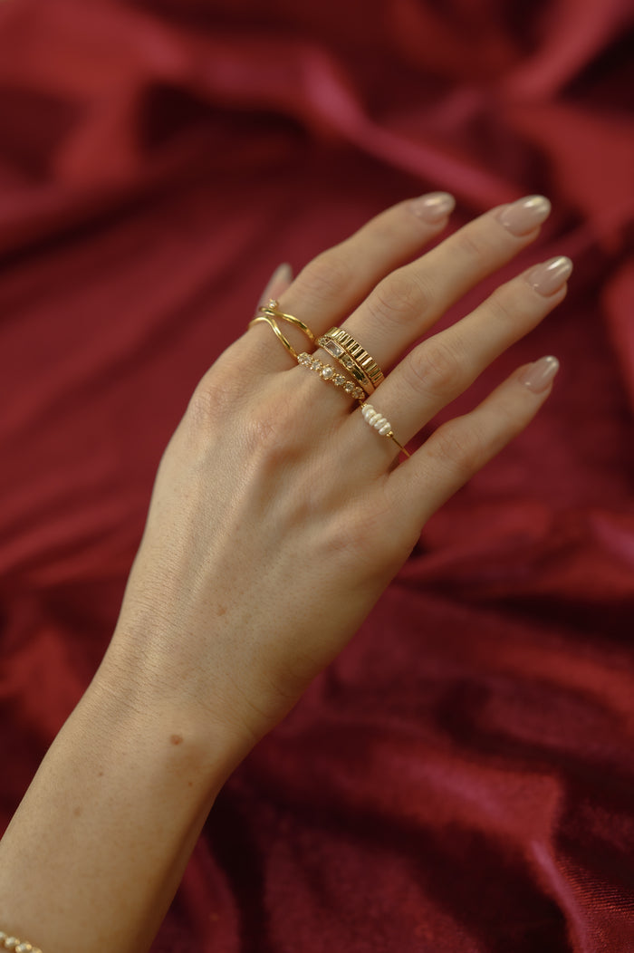 The gold Cinque Terre pearl ring from Beads by Tara, shown on a white background