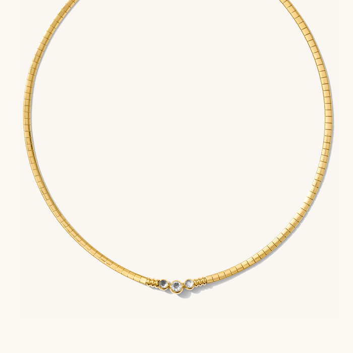 The gold Collins collar necklace set with three dainty center stones