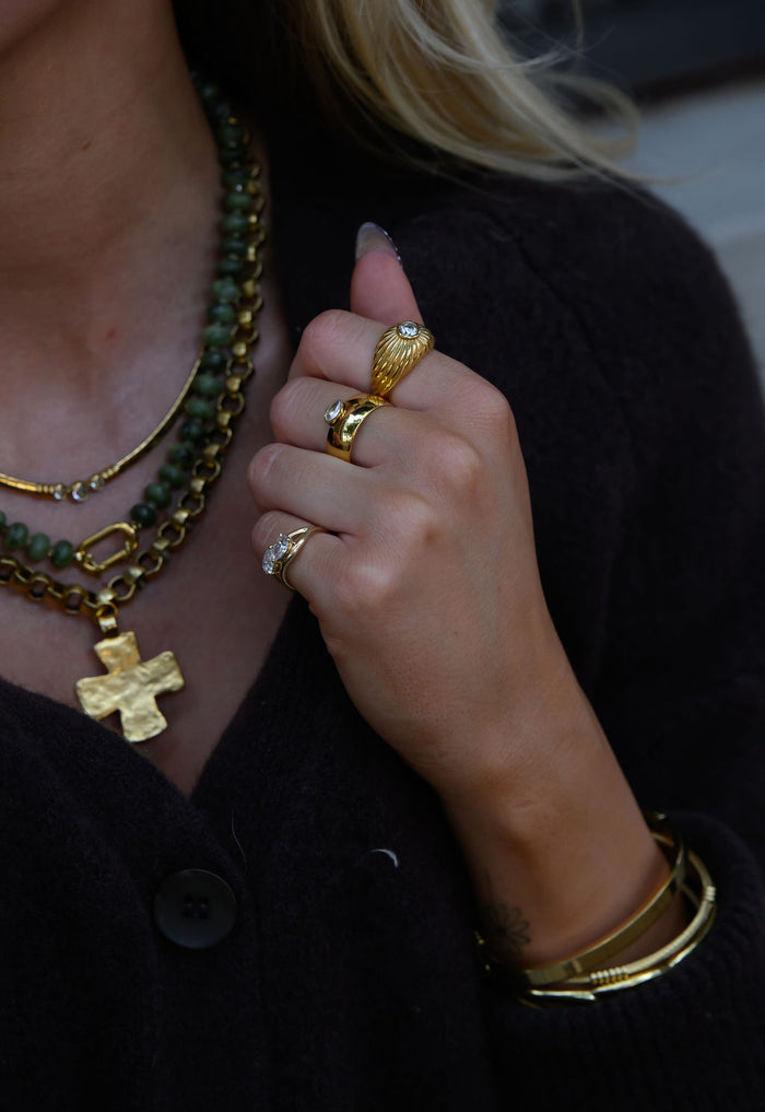 The gold Comet dome ring set with a single sparkling center stone