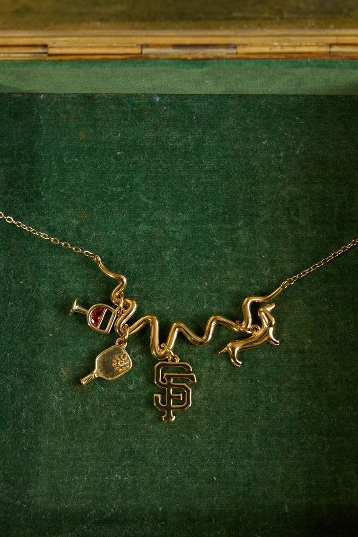 Model wearing a custom charm piece made with the Beads by Tara charm builder