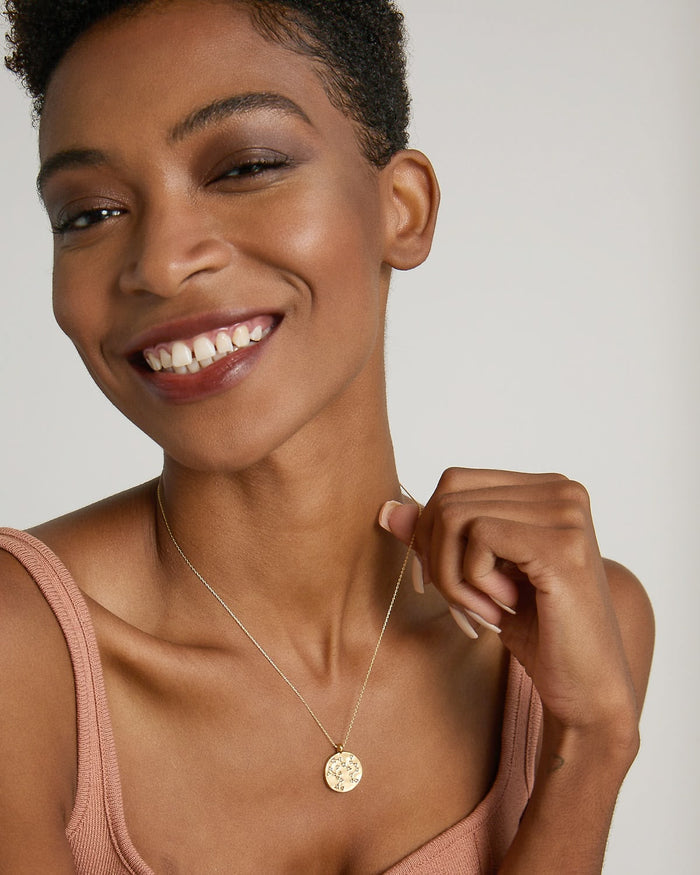 Model wearing Create Your Own Constellation Necklace in 14k gold finish