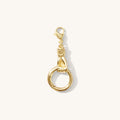 Close up of the Curio charm connector with its hand-shaped clasp on a white background