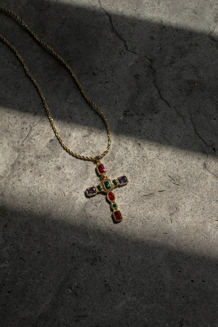 The Dallas necklace showing the dimension and scale of its statement cross
