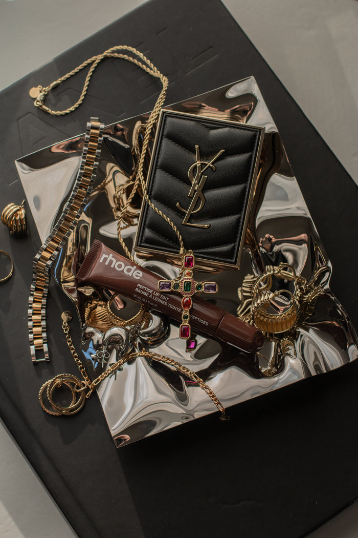 Detail of the stone settings across the Dallas necklace's jumbo cross pendant