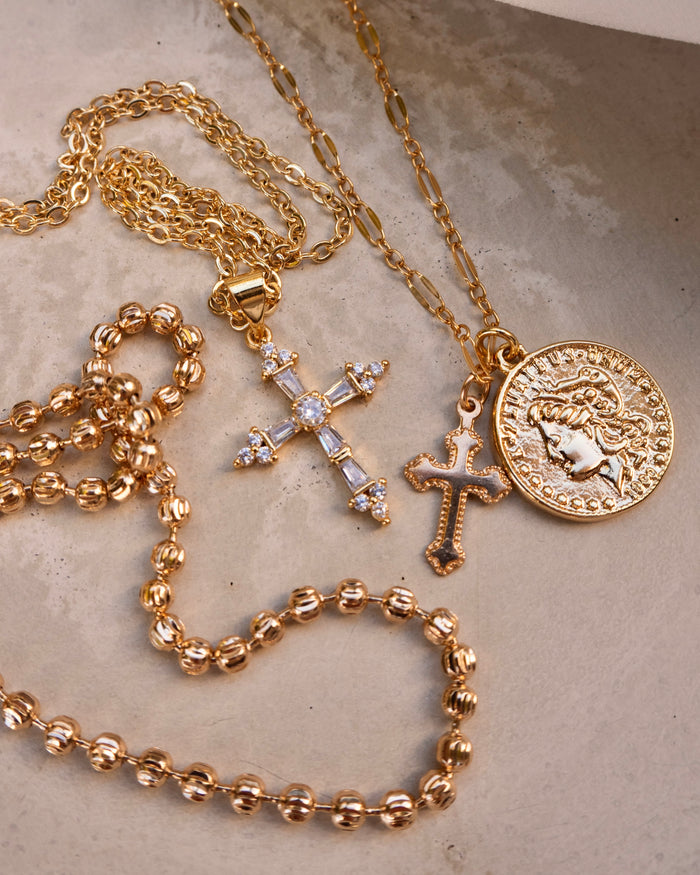 Gold-filled Desiree necklace worn layered with other dainty chains