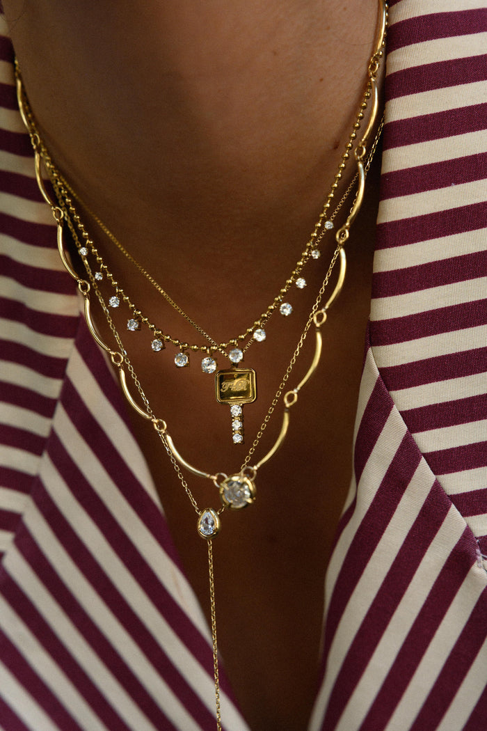 Gold Diamond Rain necklace scattered with shimmering white topaz stones