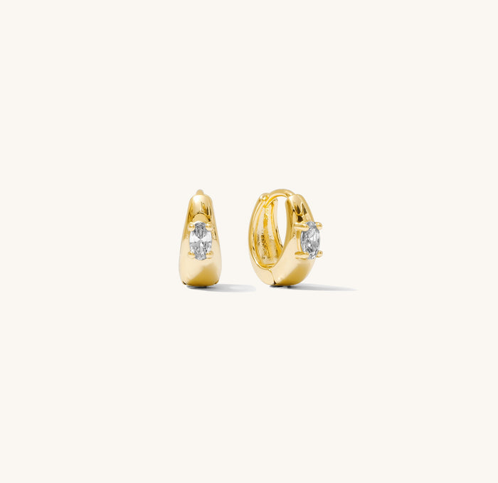 Close up shot of stone hoop earrings on a white background
