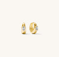 Close up shot of stone hoop earrings on a white background