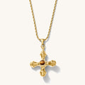 Close up of the gold Dune necklace with a tiger's eye center stone on a white background