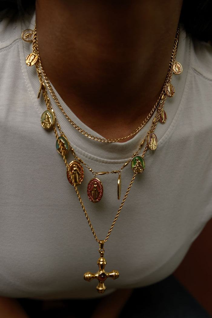 The gold Dune necklace with a tiger's eye center stone photographed on a white background
