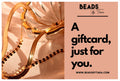 A photo of gold jewelry on a pink background next to text that reads "Beads by Tara - A gift card, just for you. beadsbytara.com"