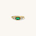 East West Emerald ring with a horizontal emerald stone in a textured bezel