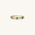 Emerald Drop ring in 14k gold vermeil with green stones on a pavé band