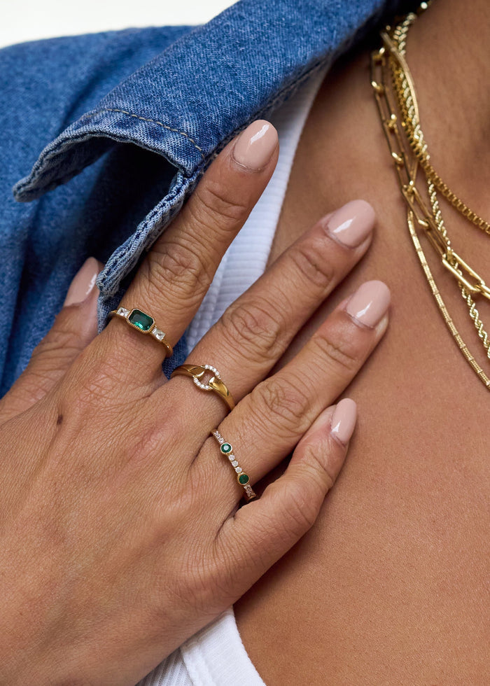 Close view of the green stones and pavé setting on the Emerald Drop ring