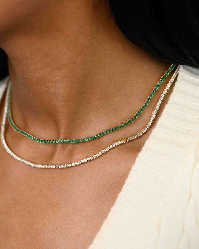 The gold Emerald Everyday tennis necklace, designed by Beads by Tara